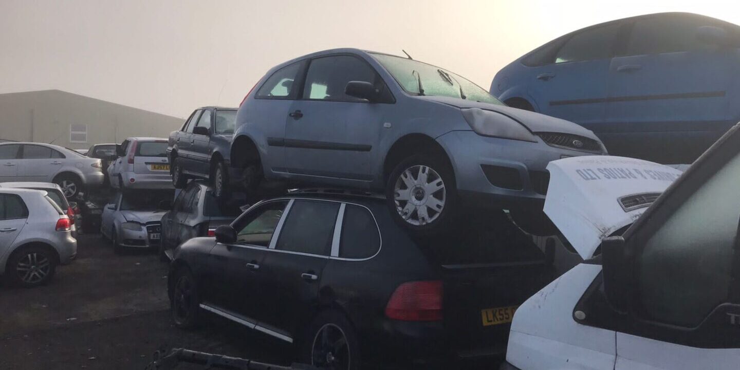A bunch of cars that are stacked on top of each other