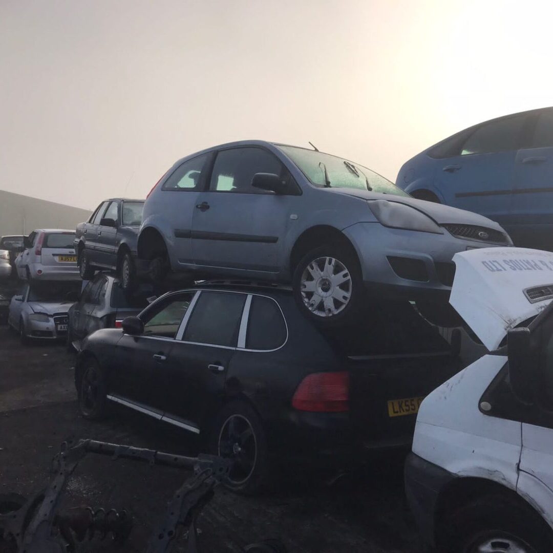 A bunch of cars that are stacked on top of each other